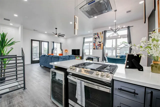 a kitchen with a refrigerator a sink and cabinets