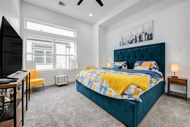 a bathroom with a double vanity sink a large mirror and shower