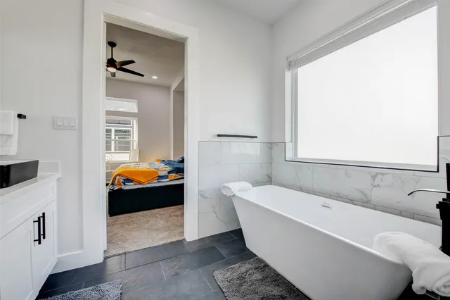 a bathroom with a sink and a bathtub