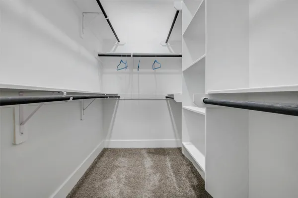 a view of an empty walk in closet