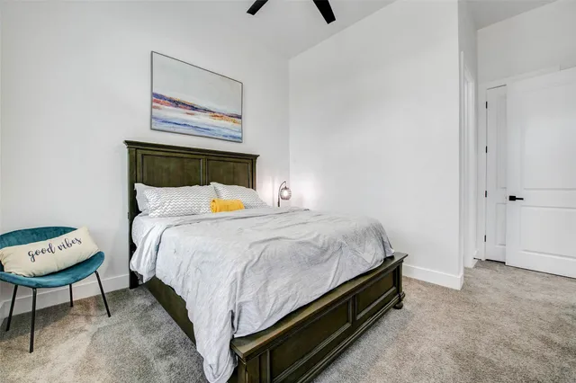a living room with furniture and a flat screen tv with wooden floor