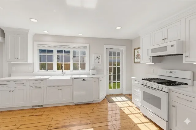 a kitchen with stainless steel appliances granite countertop a stove and a sink