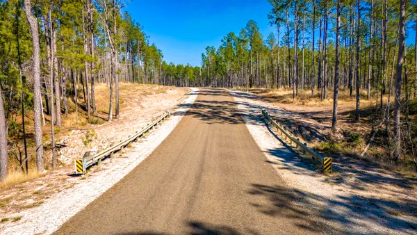 a view of swimming pool with a yard