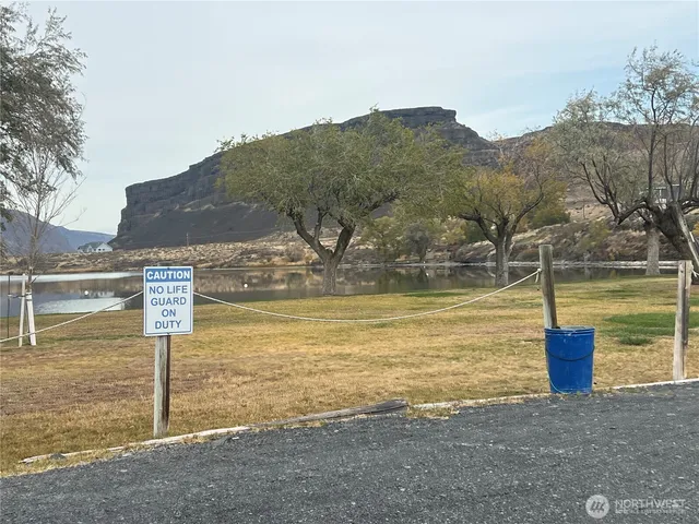 a view of a big house with a big yard