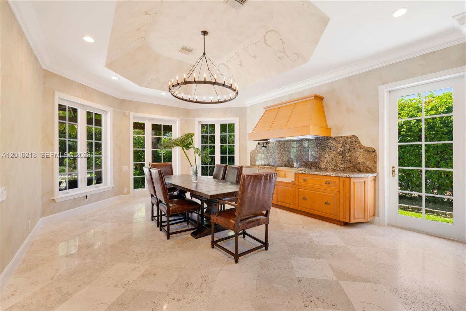 6905 Southwest 75th Avenue Miami, FL 33143 - Photo 26 of 85 a dining room with furniture a chandelier and a rug