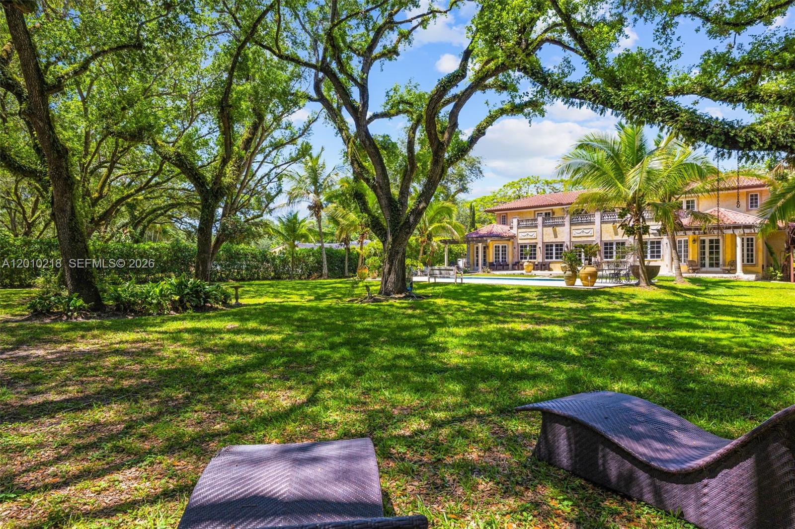 6905 Southwest 75th Avenue Miami, FL 33143 - Photo 3 of 85 a view of a big yard with plants and large trees