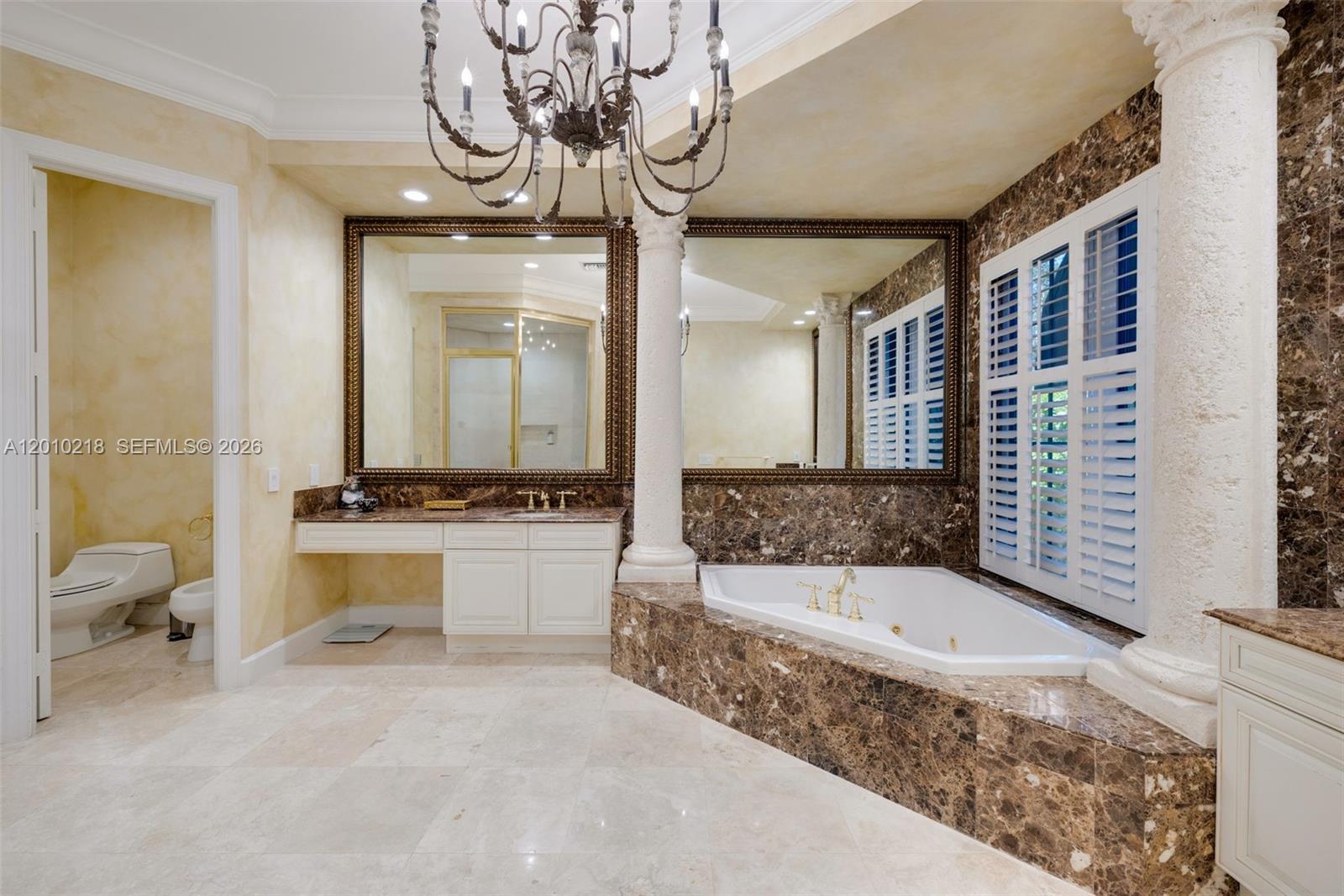 6905 Southwest 75th Avenue Miami, FL 33143 - Photo 39 of 85 a bathroom with a tub a sink and a mirror
