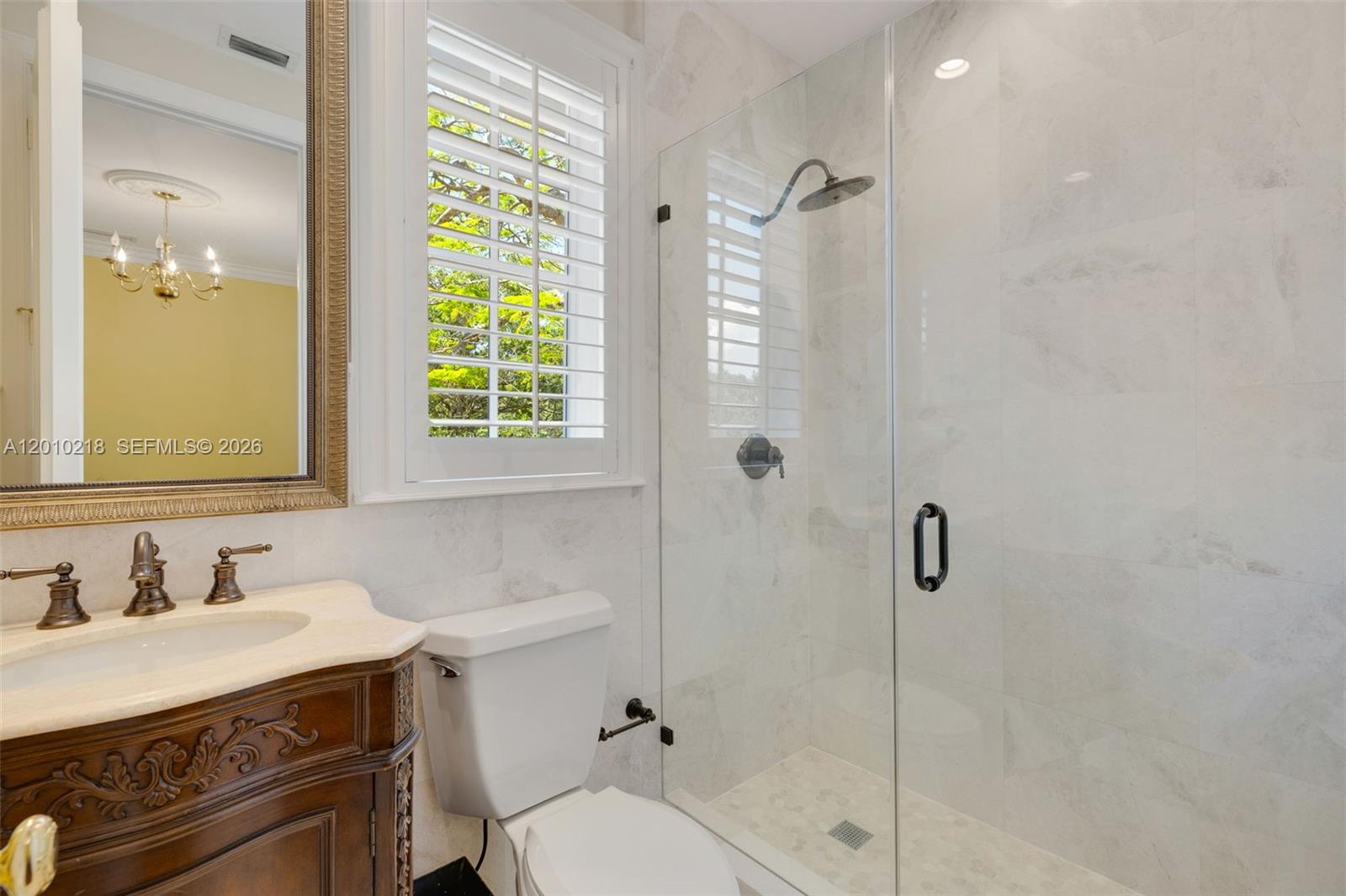 6905 Southwest 75th Avenue Miami, FL 33143 - Photo 44 of 85 a bathroom with a sink toilet and shower