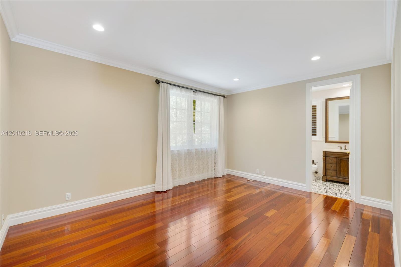 6905 Southwest 75th Avenue Miami, FL 33143 - Photo 51 of 85 wooden floor in an empty room with a window
