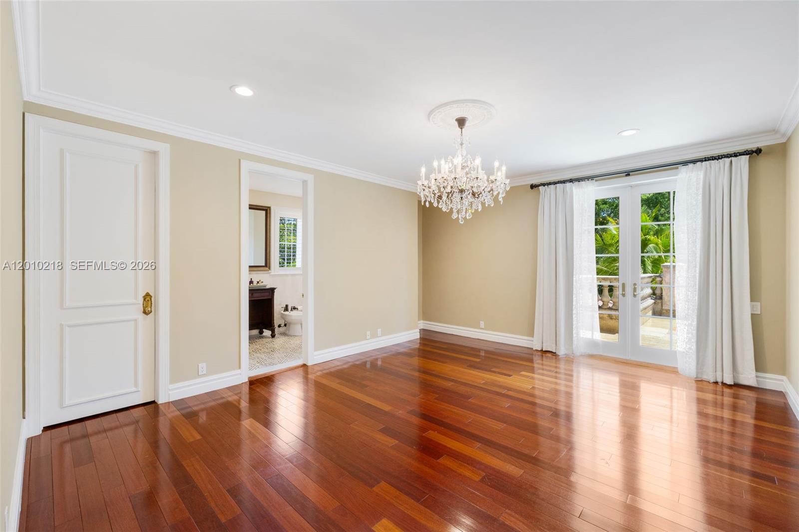 6905 Southwest 75th Avenue Miami, FL 33143 - Photo 53 of 85 a view of an empty room with wooden floor and a window