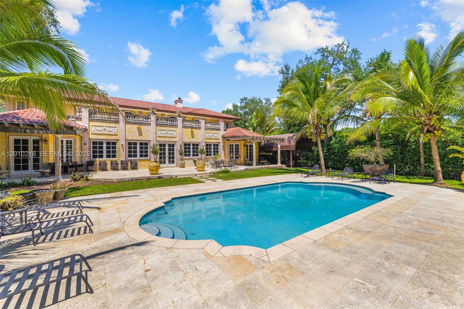 6905 Southwest 75th Avenue Miami, FL 33143 - Photo 62 of 85 a view of a swimming pool with a garden