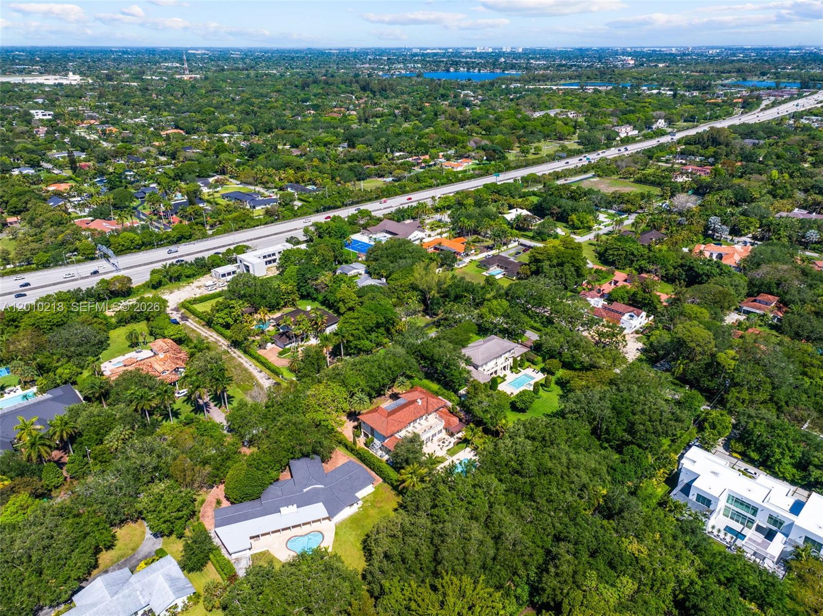 6905 Southwest 75th Avenue Miami, FL 33143 - Photo 80 of 85 an aerial view of residential houses with outdoor space and trees