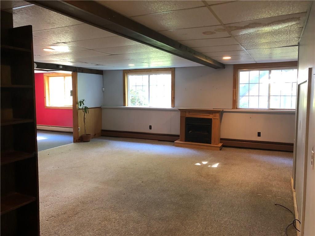 3 Allen Street Jay, ME 04239 - Photo 28 of 32 Finished basement with gas fireplace.