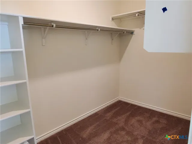 a view of an empty walk in closet