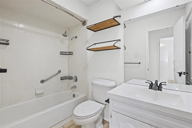 a bathroom with a sink a toilet and a bathtub