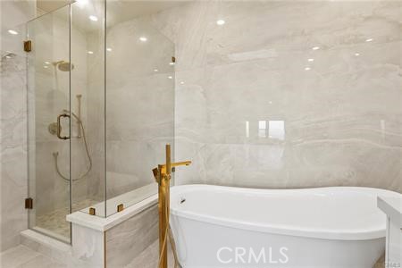 5 Argo Irvine, CA 92603 - Photo 11 of 24 a bathroom with a tub a mirror and shower