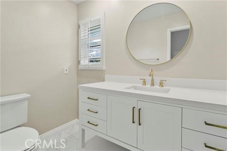5 Argo Irvine, CA 92603 - Photo 12 of 24 a bathroom with a sink a toilet and a mirror