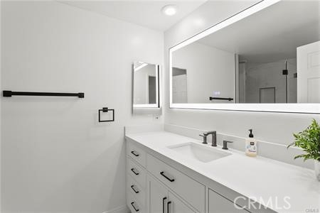5 Argo Irvine, CA 92603 - Photo 14 of 24 a bathroom with a sink and a mirror