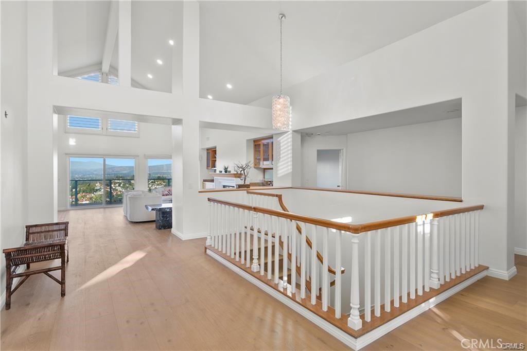 5 Argo Irvine, CA 92603 - Photo 3 of 24 a view of a hallway with dining area and chandelier