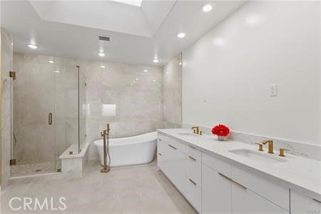 5 Argo Irvine, CA 92603 - Photo 10 of 24 a bathroom with a tub sink a toilet and a shower