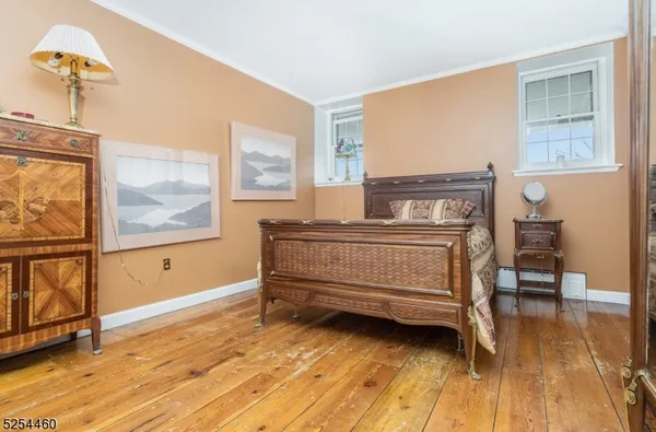 a living room with furniture and a ceiling fan