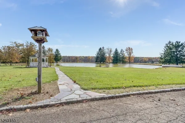 a view of a lake with a yard