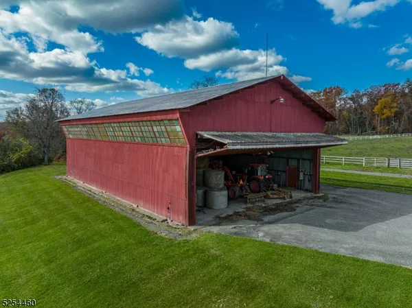 a view of a backyard with a barn