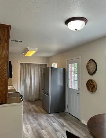 a kitchen with granite countertop a stove and a sink