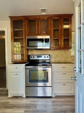 a view of a dining room with furniture and window