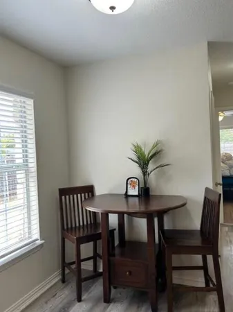 a kitchen with stainless steel appliances granite countertop a stove and cabinets