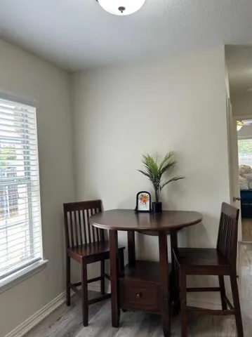 a kitchen with stainless steel appliances granite countertop a stove and cabinets