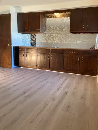 a spacious bathroom with a sink and a mirror
