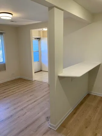 wooden floor and window in a room
