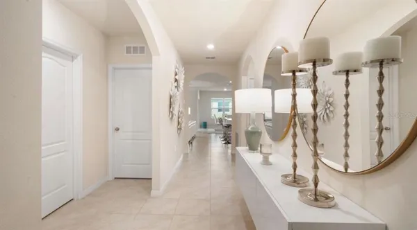 a view of a living room and chandelier