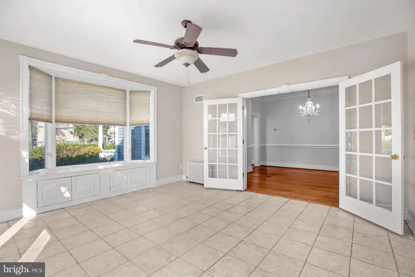 a bathroom with a granite countertop toilet and a sink
