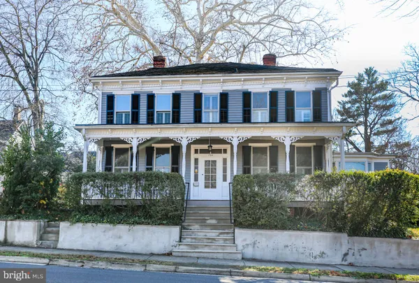 a view of a porch with wooden floor and stairs