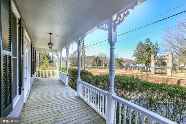 a view of entryway with wooden floor and stairs