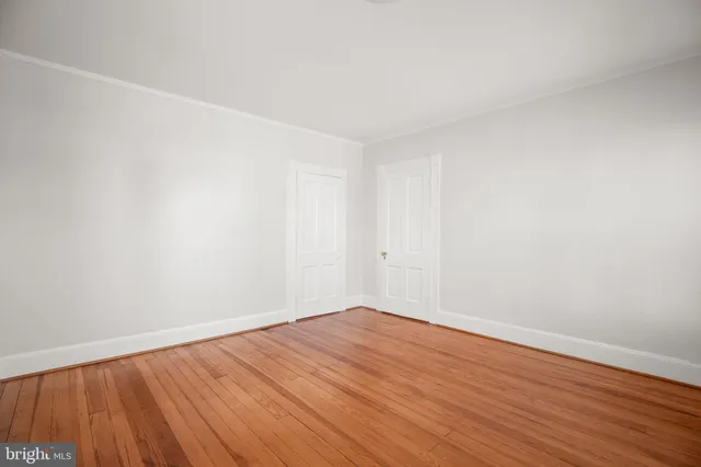 a view of house with backyard and garden