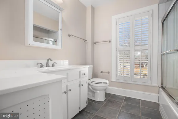 a view of a house with potted plants