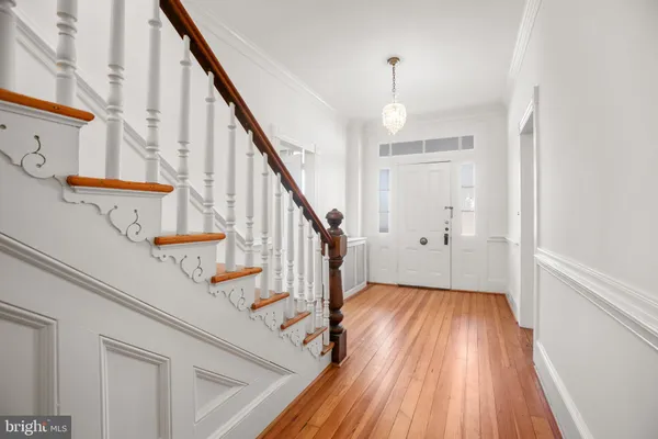 a view of entryway with wooden floor