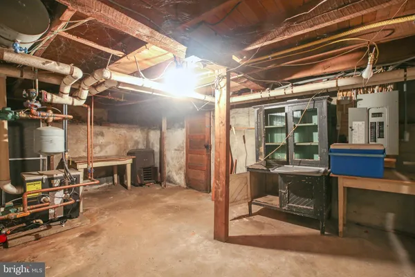 a view of dirt yard with a large tree