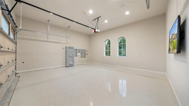 a view of a patio with furniture and a garden