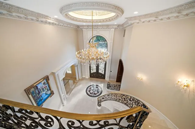 a table with a vase and a chandelier