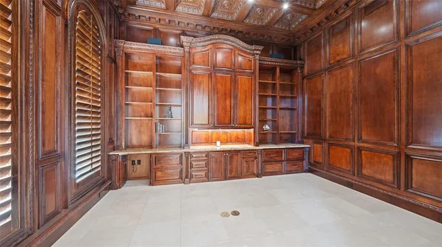 a view of an empty room with wooden walls