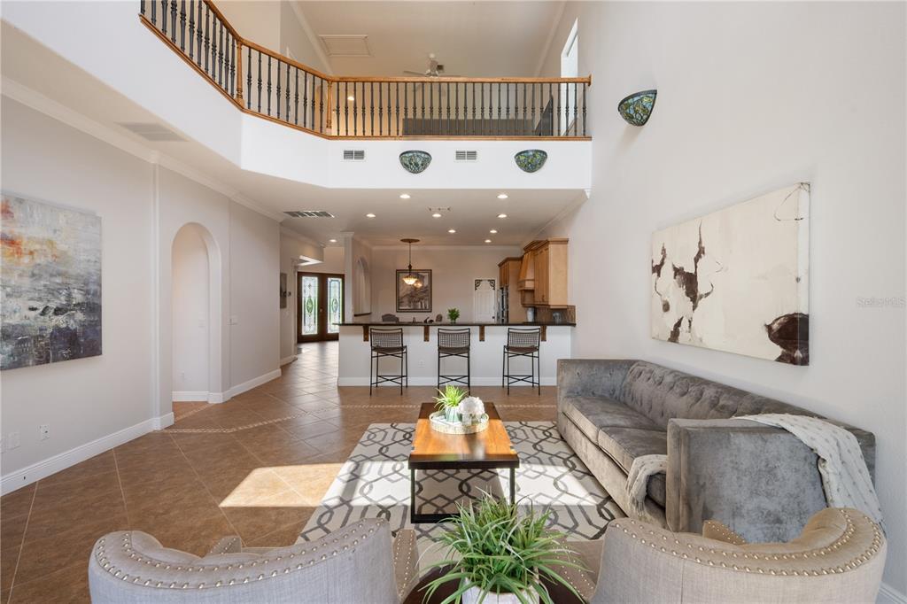 8119 Vía Rosa Orlando, FL 32836 - Photo 11 of 62 a living room with furniture and a chandelier