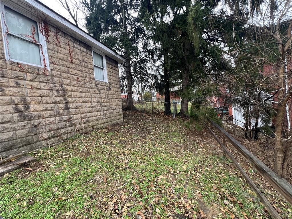 216 Suncrest Street Pittsburgh, PA 15210 - Photo 27 of 32 a view of a backyard with large trees