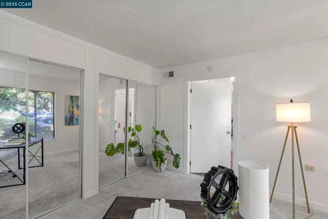 a view of a entryway and room with furniture