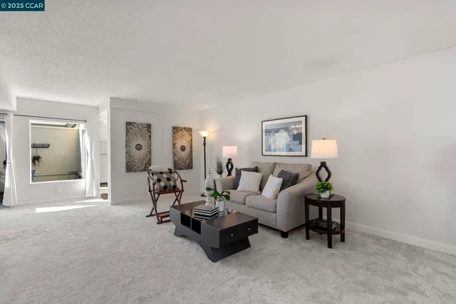a living room with furniture and a lamp