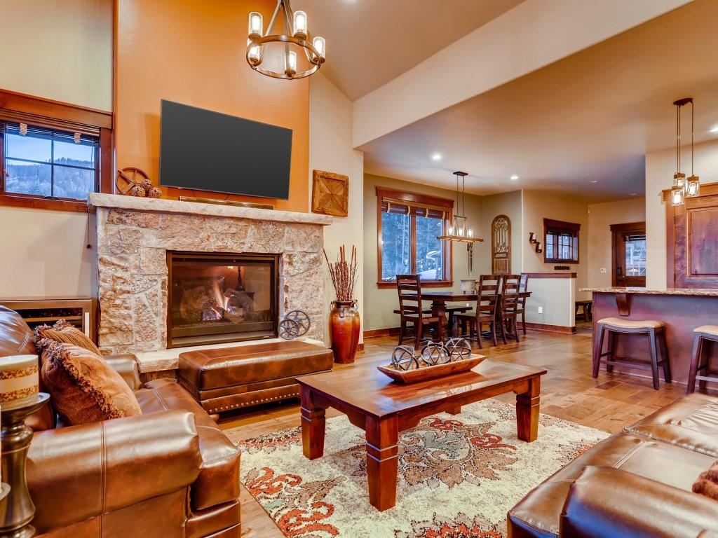 869 Independence Road, Unit B Keystone, CO 80435 - Photo 14 of 35 a living room with furniture a fireplace and a flat screen tv