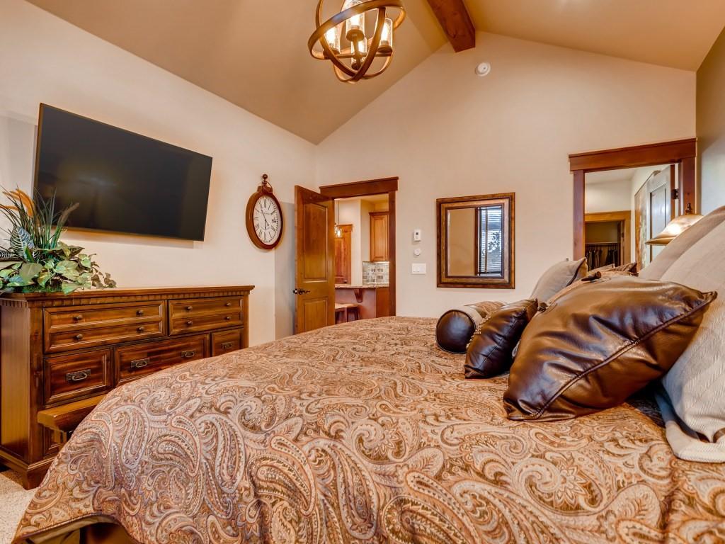 869 Independence Road, Unit B Keystone, CO 80435 - Photo 22 of 35 a bedroom with a bed and a flat screen tv